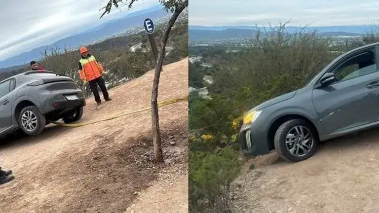 Vehículo Peugeot 208 gris al borde de un precipicio en el dique El Jumeal